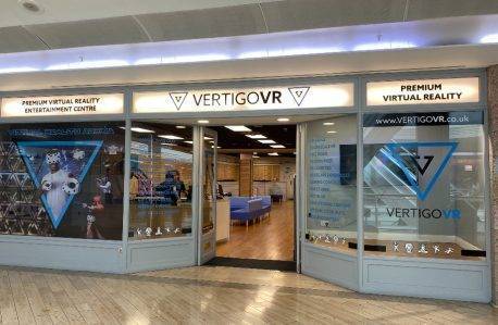 Picture of Vertugo VR shop front in the Galleries. The door is open and staff can be seen behind the till on the left.